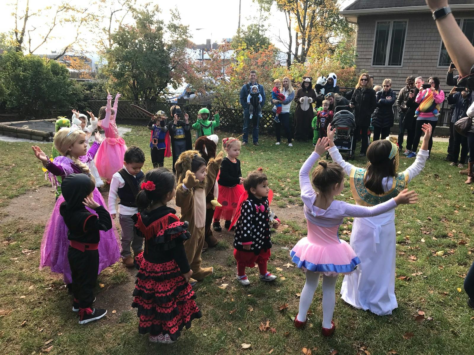 Children in costumes playing outdoors