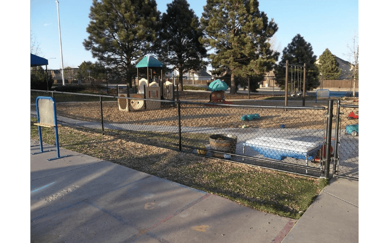 Playground with swings, play structure, and sandbox