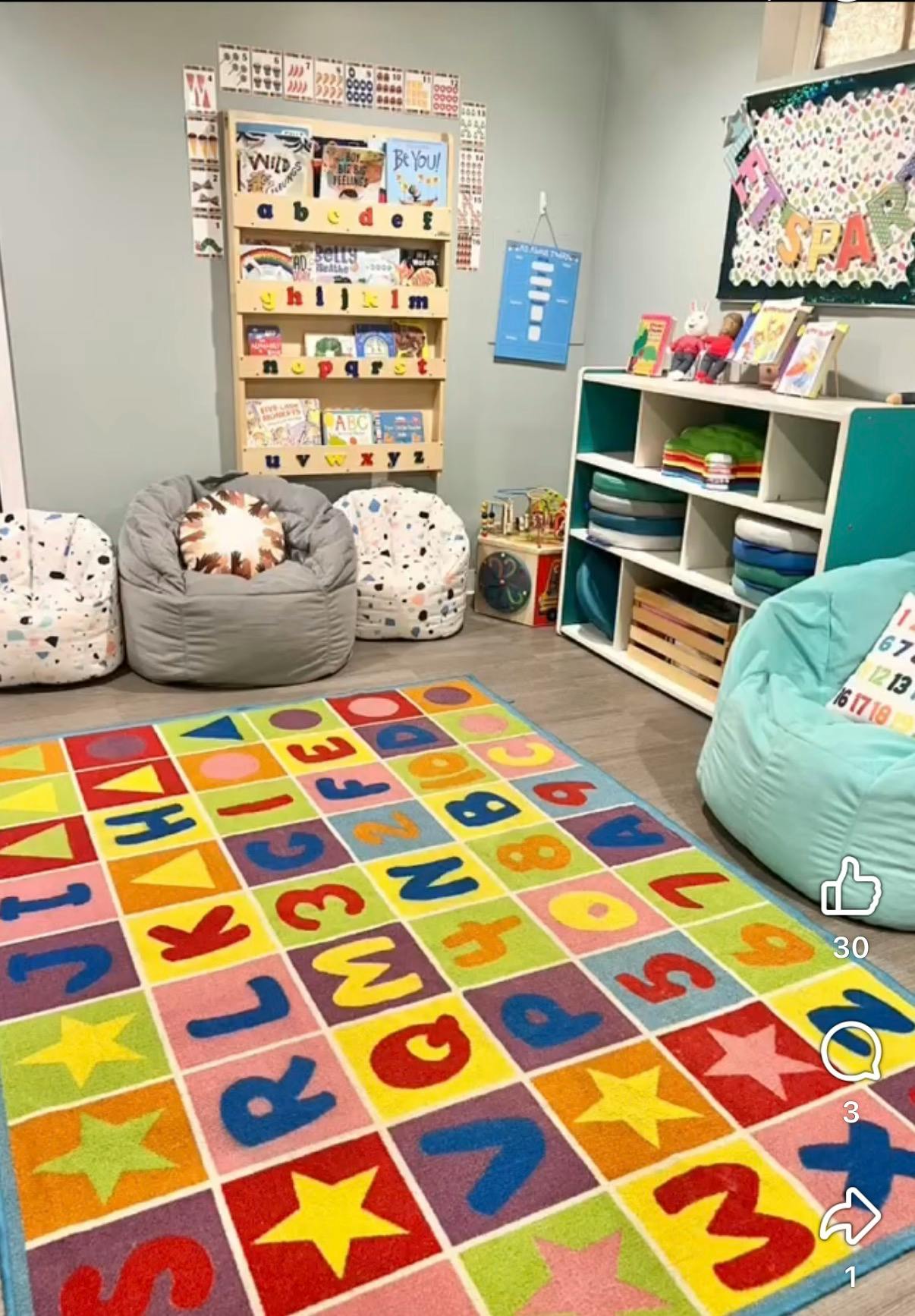 Colorful educational rug in a children reading corner with bean bag chairs