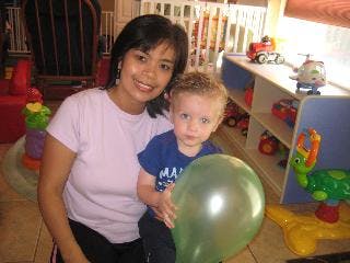 Person and child holding a balloon