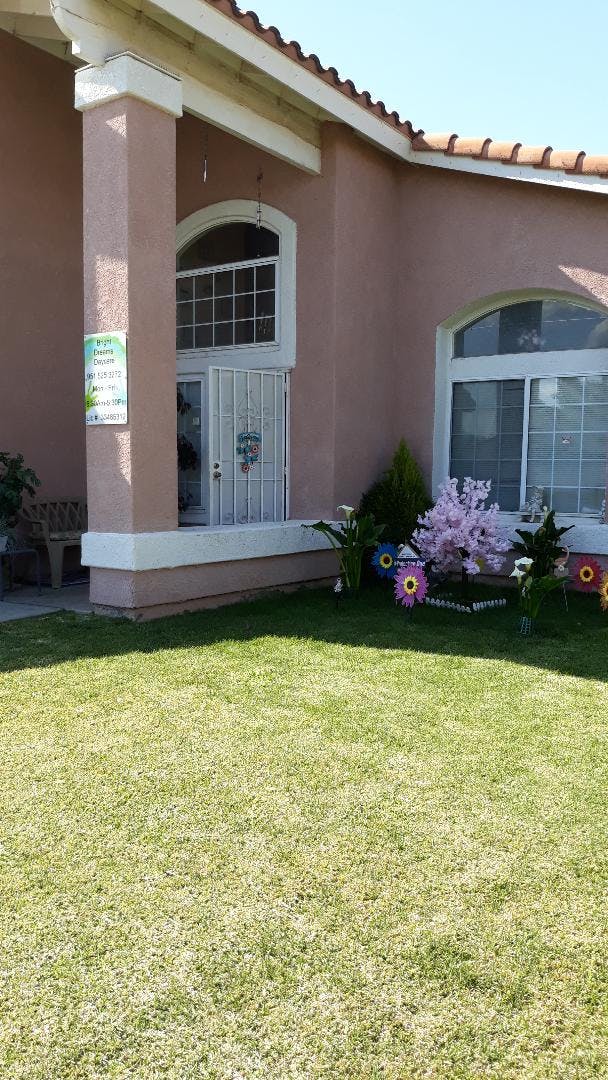 House exterior with front porch and small garden