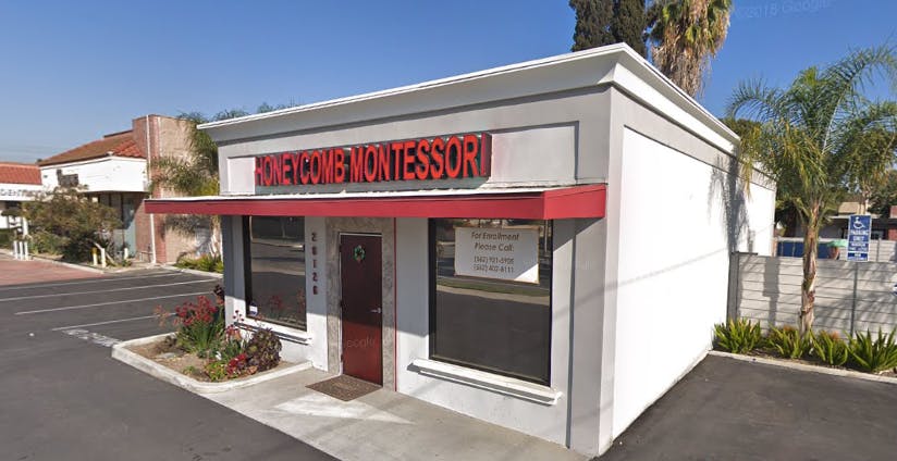 Small building with a red awning and a sign that reads "MONTESSORI"