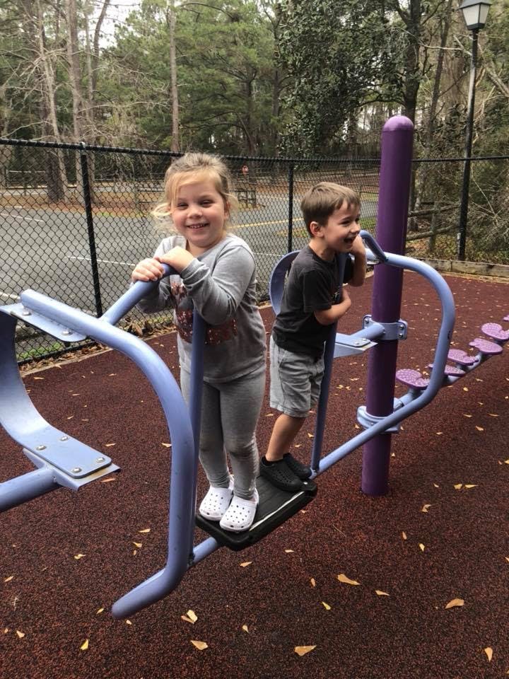 Two children on playground equipment