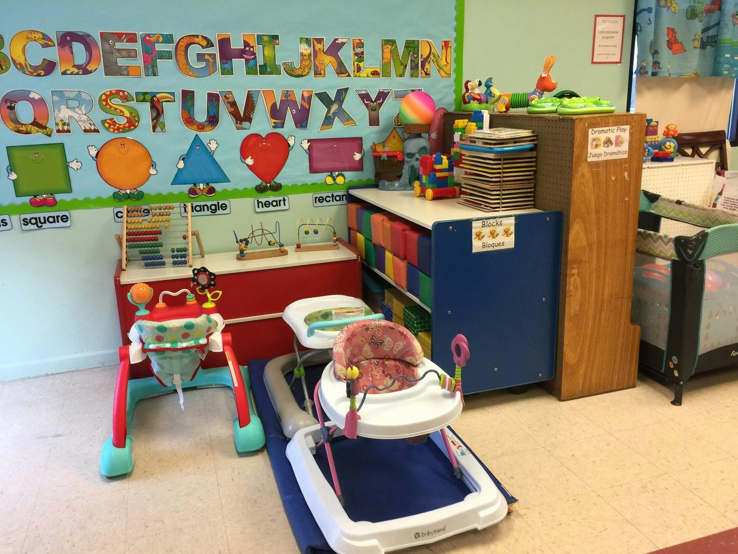 Infant walkers and play area in a classroom