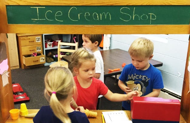 Children playing in an ice cream shop