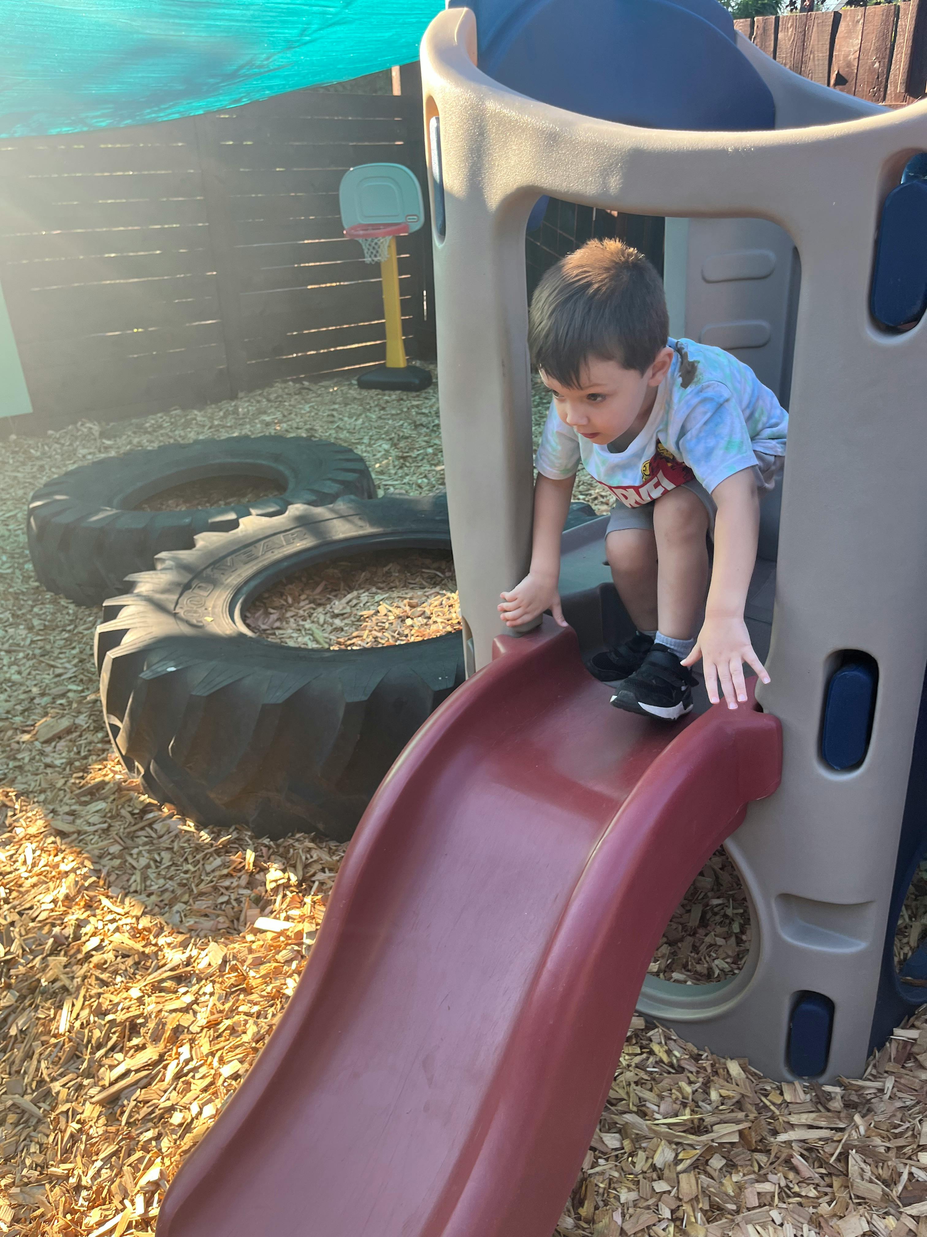 Child on a playground slide