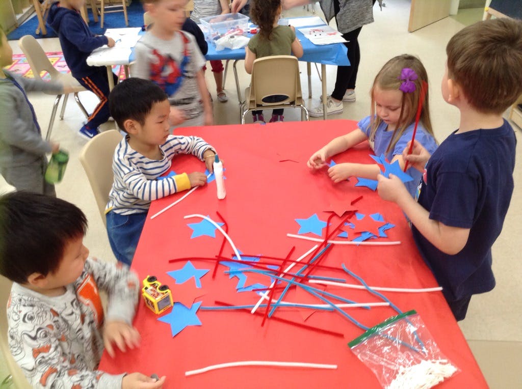 Children doing crafts at a table