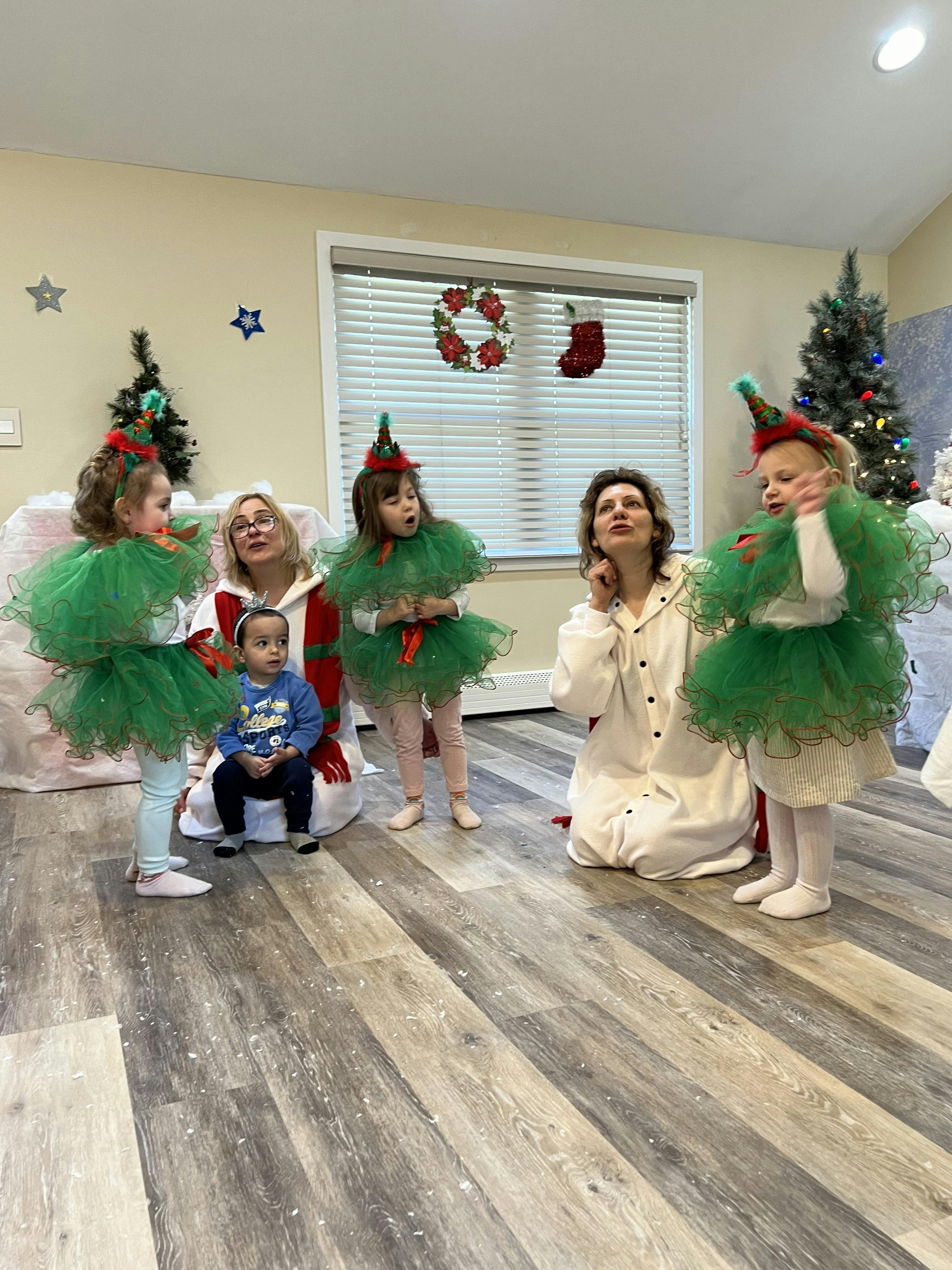 Two adults and three children in festive costumes