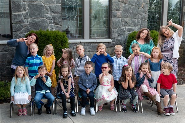 Group of children and adults making funny faces