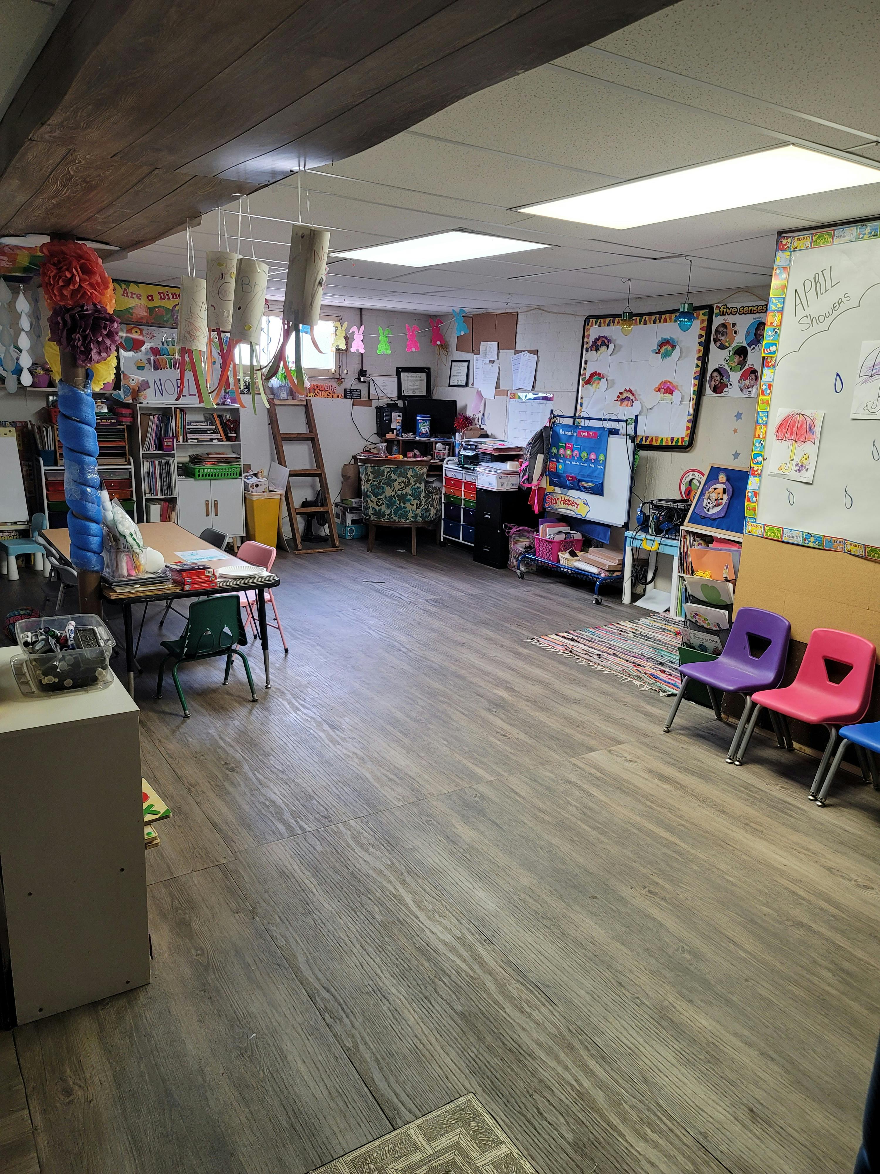 Classroom with tables, chairs, and learning materials