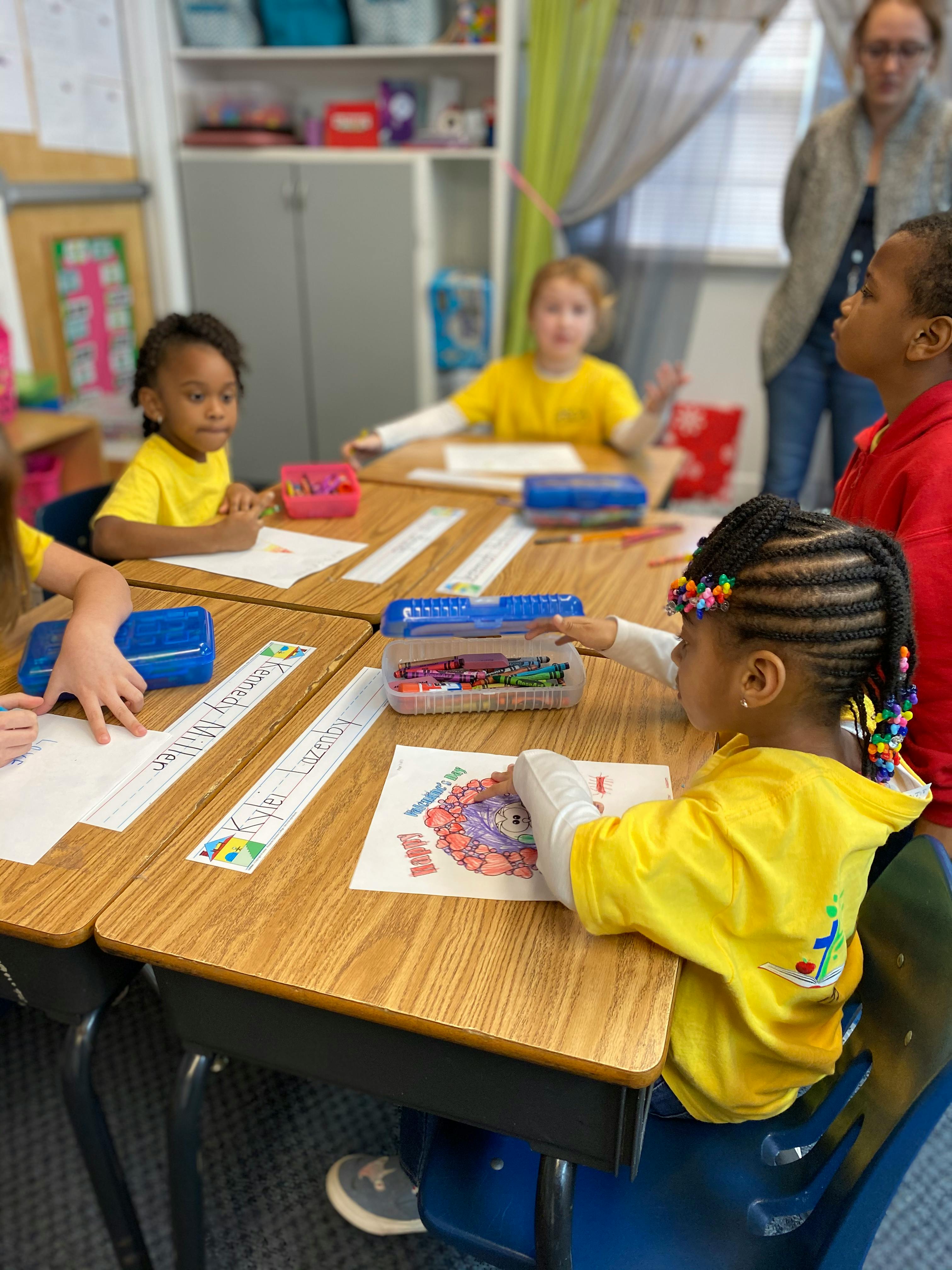 Children sitting at desks in a classroom