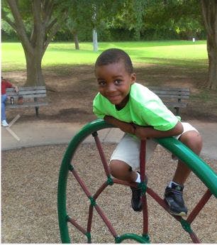 Child on playground equipment