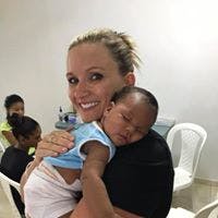 Person holding a sleeping infant