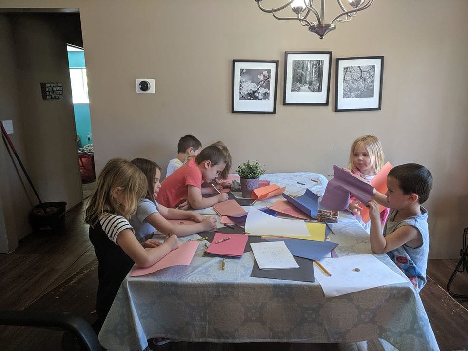 Children doing crafts at a table