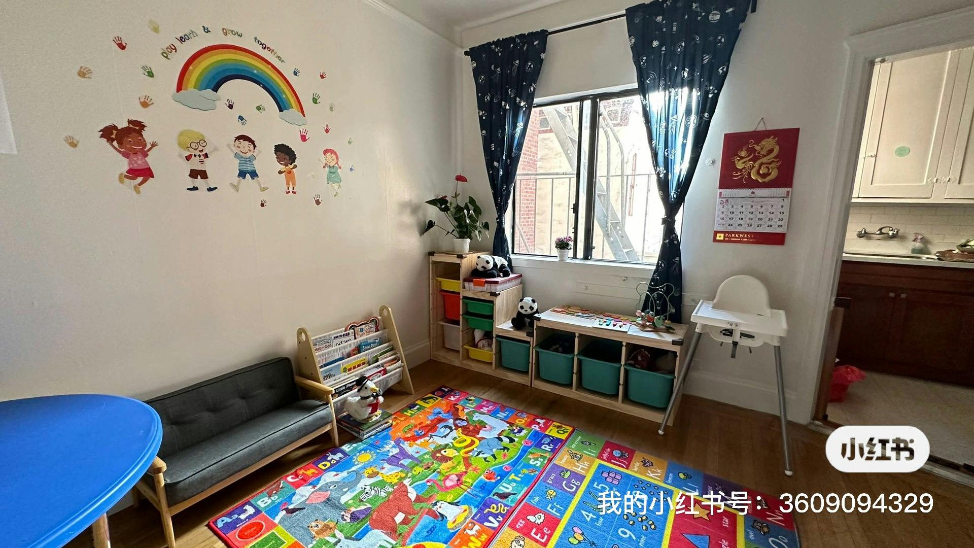 Playroom with colorful rug, wall decals, and small furniture