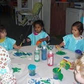 Children painting at a table