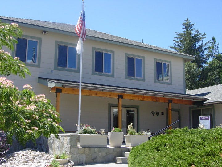 Building exterior with an American flag on a flagpole