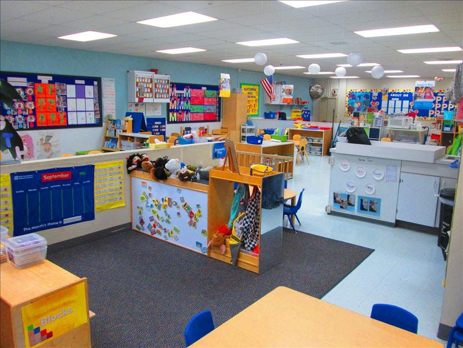 Classroom with child-sized furniture and a September calendar