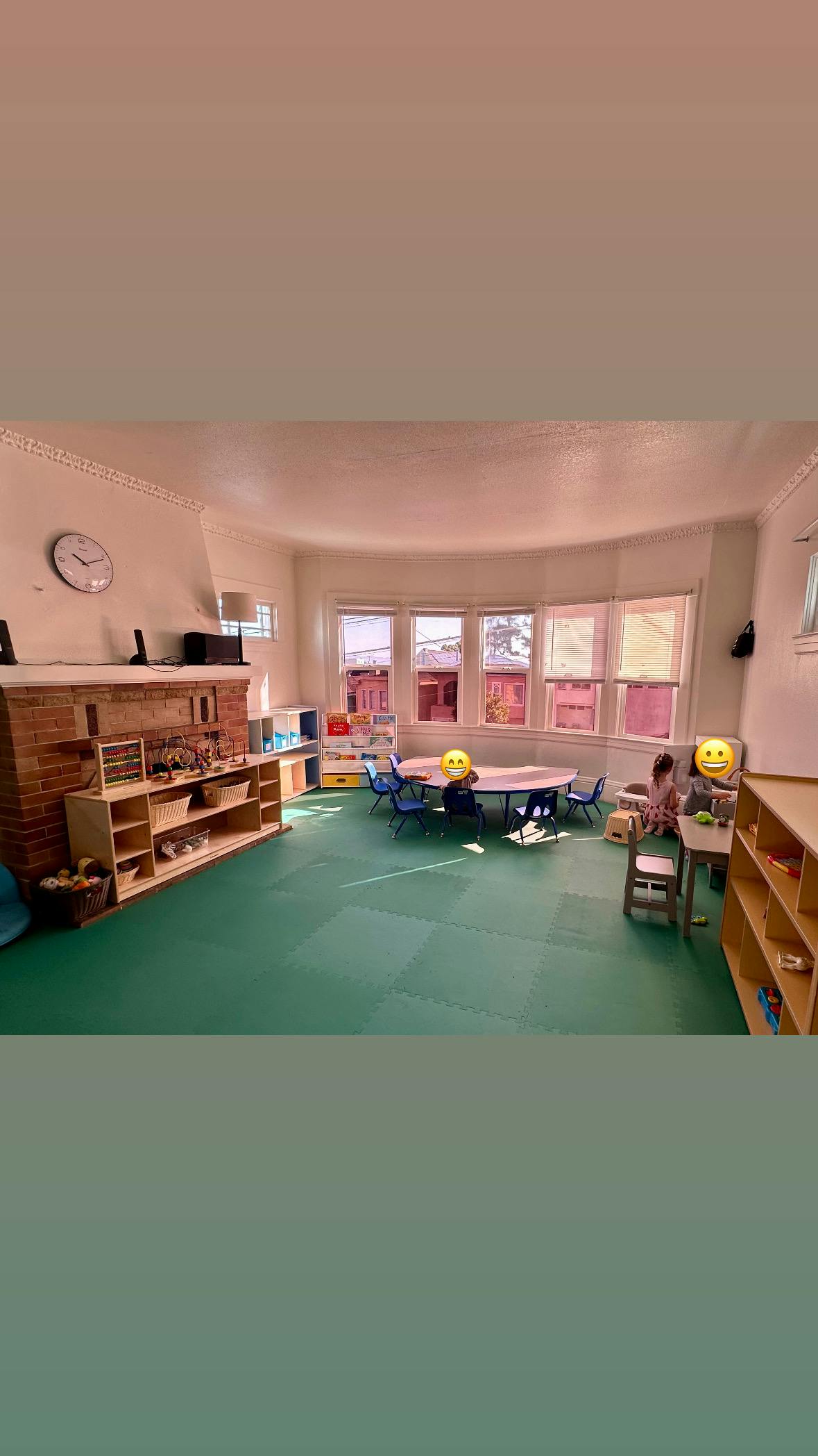 Classroom with tables, chairs, and shelves