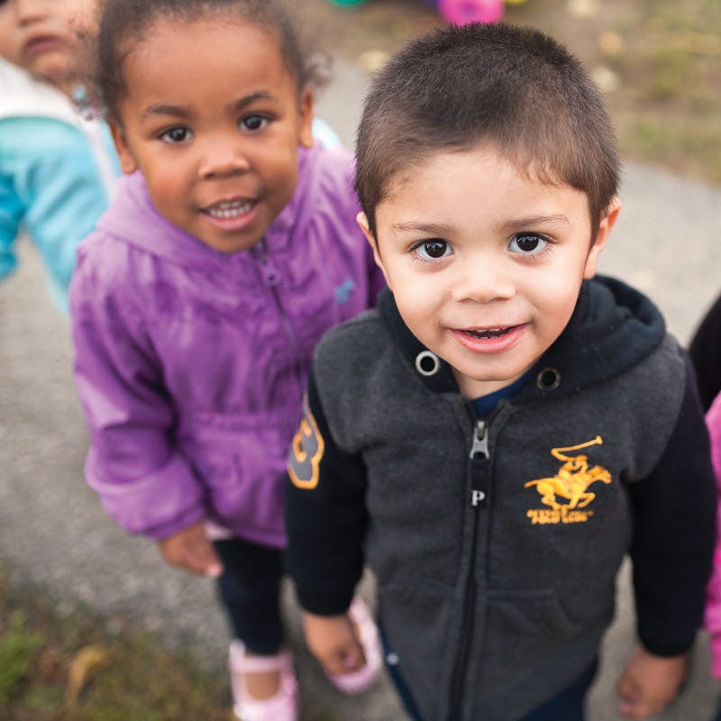Two children looking up at the camera