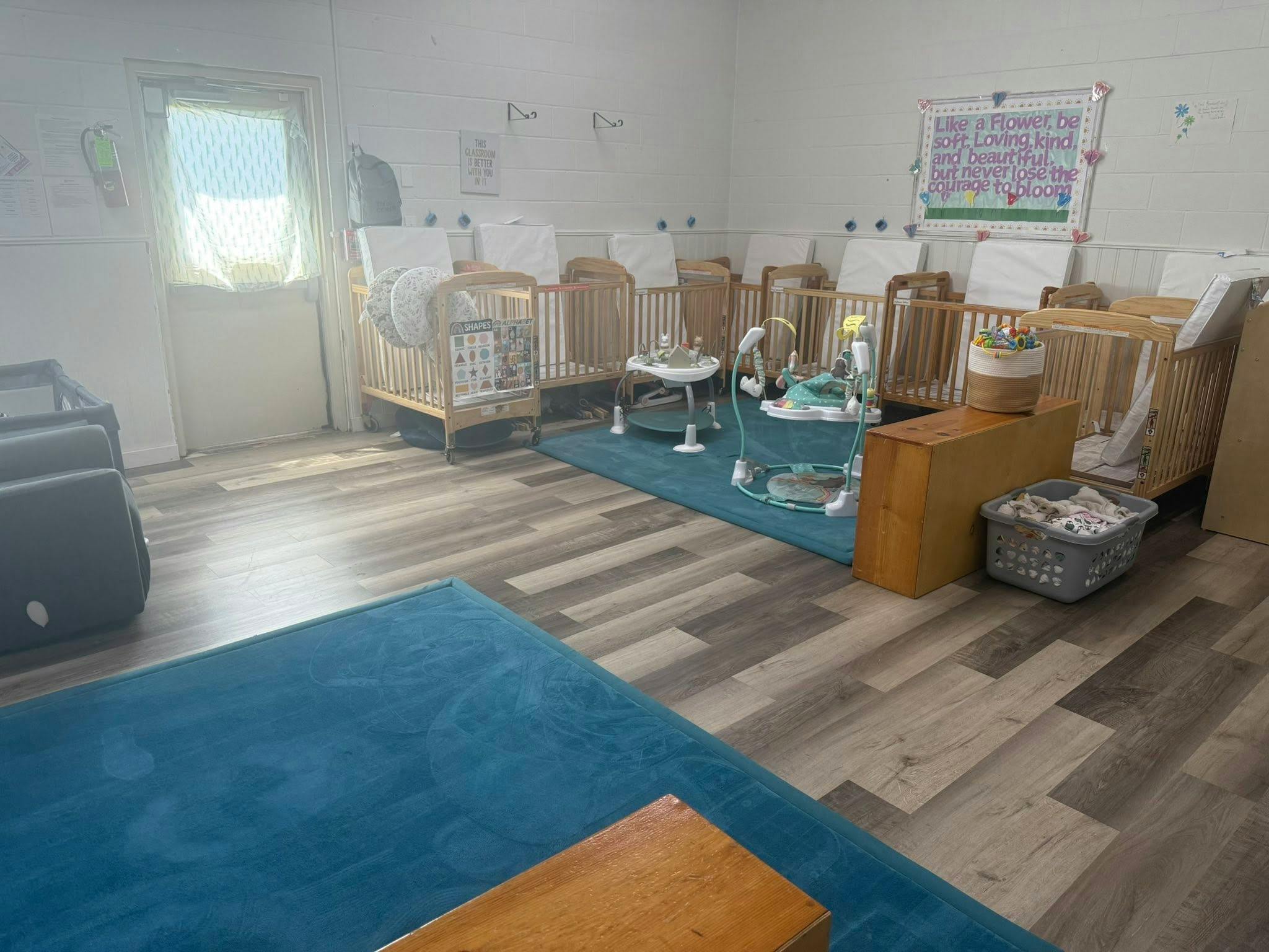 cribs in a daycare classroom