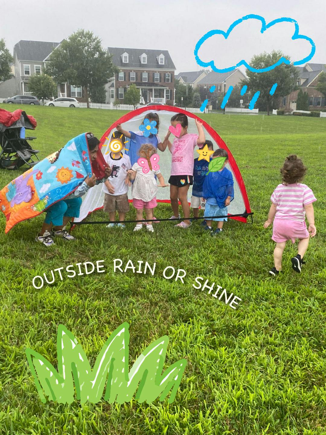 A person and children huddled under a small tent on a grassy field in the rain