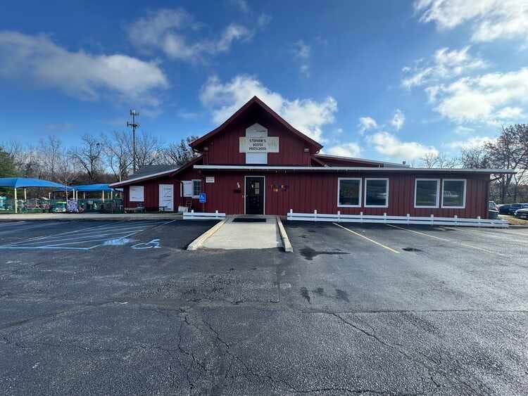 Red building with a gabled roof and a sign that says "STUPPY-HOOVER PRESCHOOL"