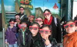 Group of children and adults wearing 3D glasses