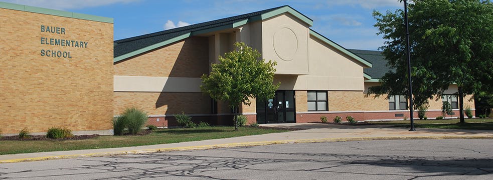 Exterior of a school building with "ELEMENTARY SCHOOL" visible on the wall