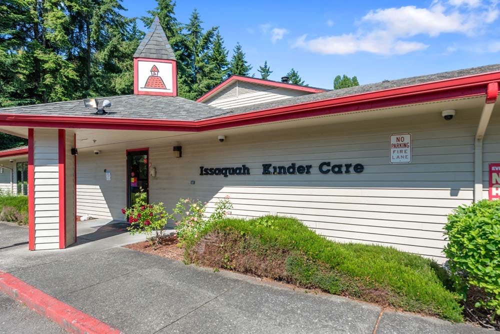 Issaquah Kinder Care building exterior with signage and trees
