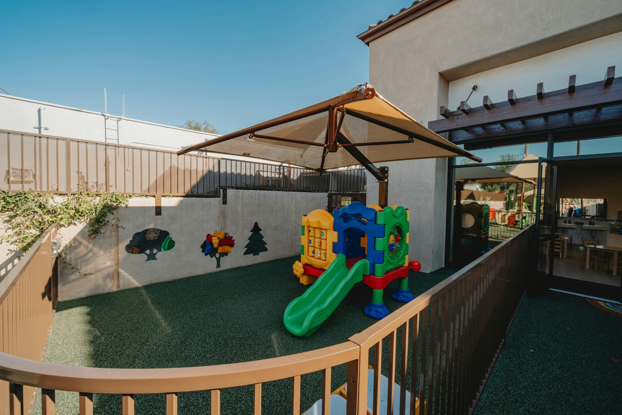 Colorful playground with a slide and shade canopy