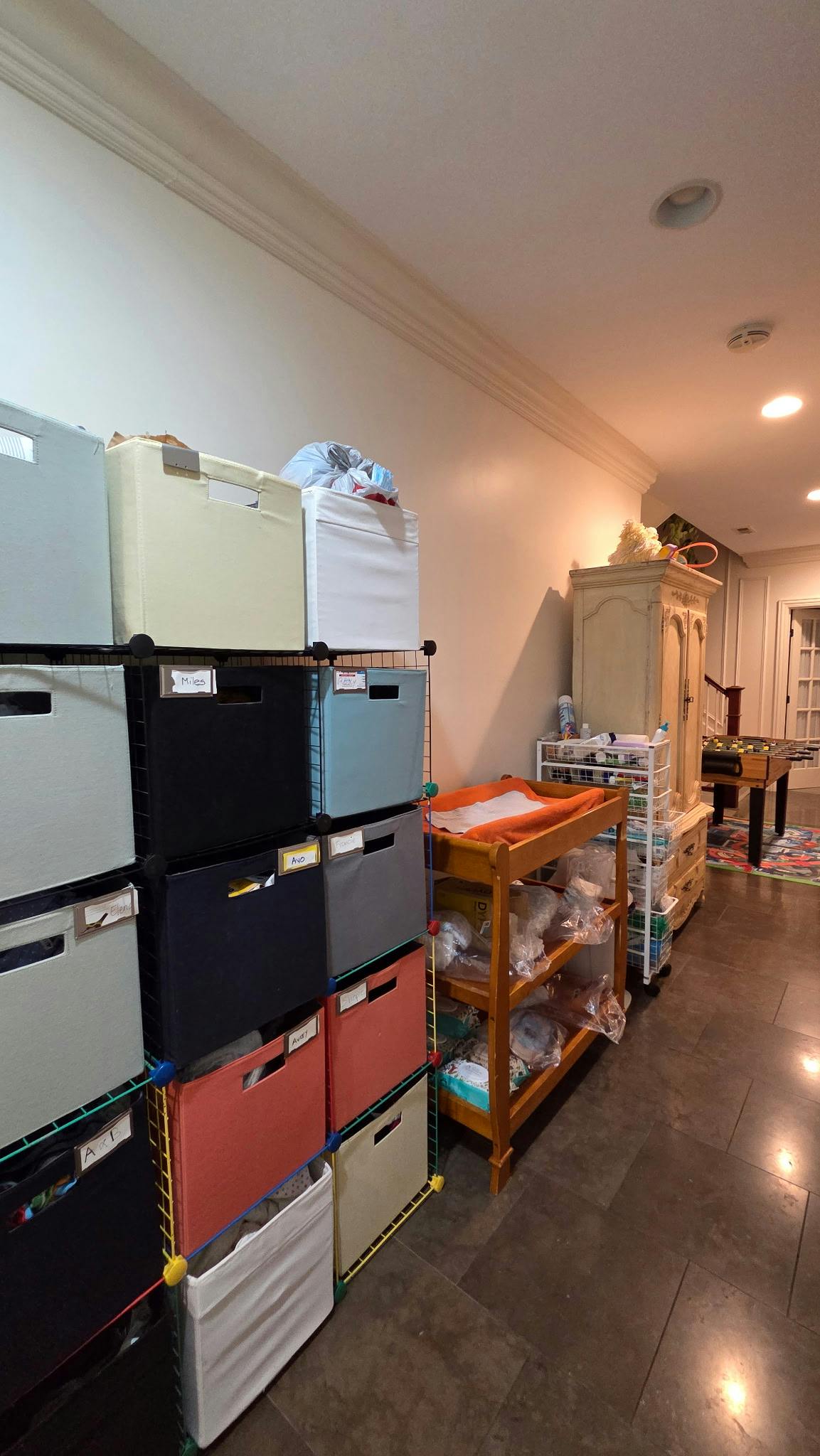 Storage cubes and shelves with various items in a room