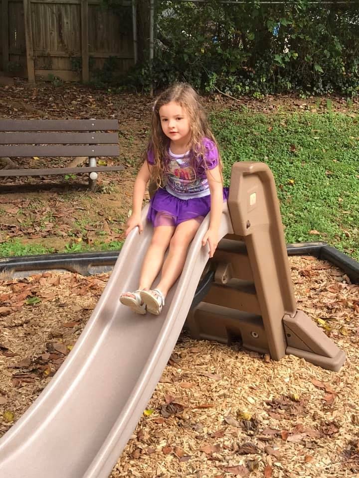 Child on a playground slide