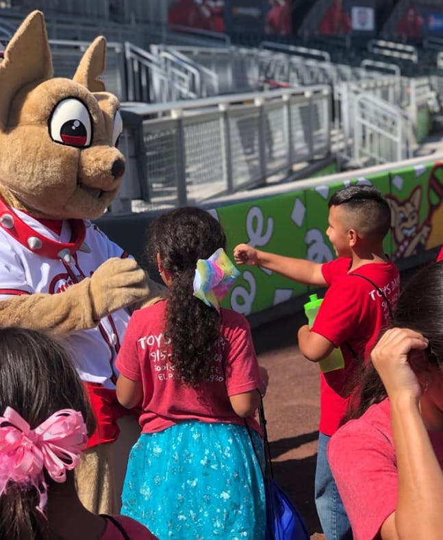 Mascot interacting with children