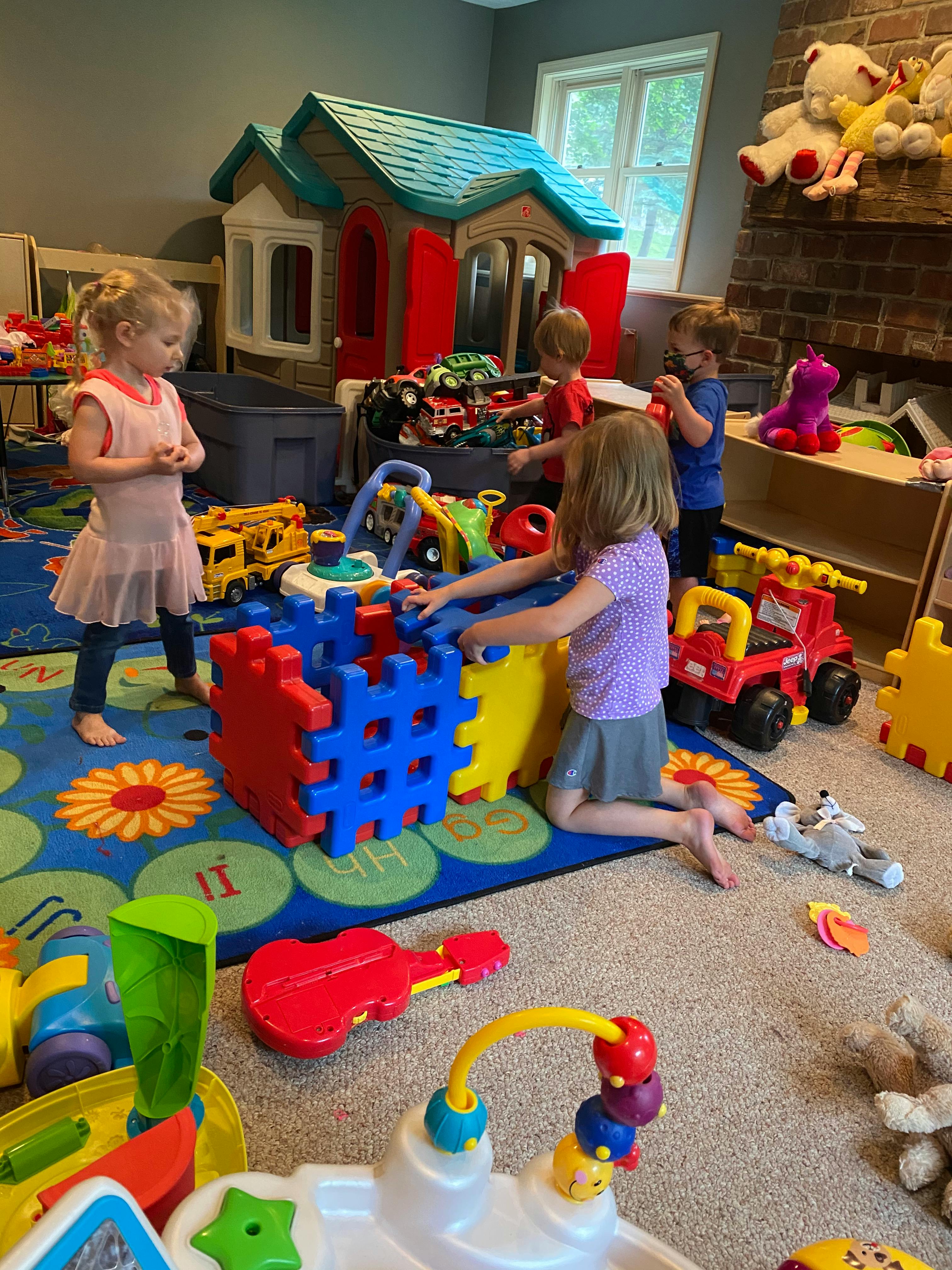 Children playing with toys in a room