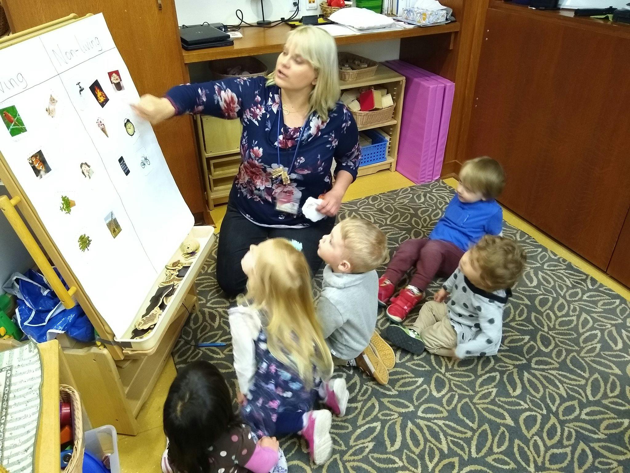 Person teaching children in a classroom