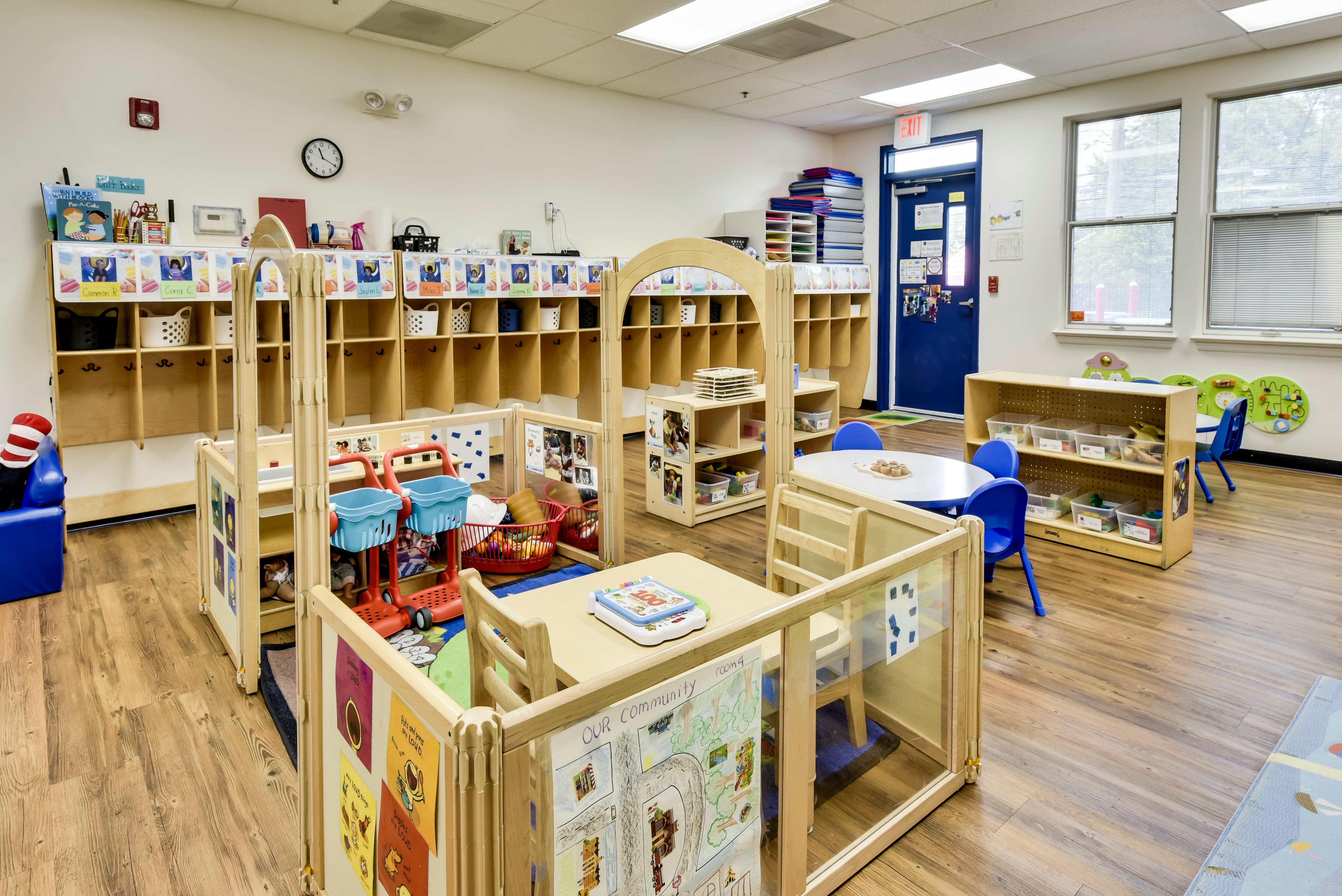 Classroom interior with partitioned play areas and storage cubbies