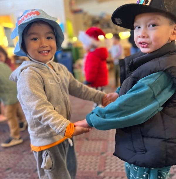 Two children holding hands