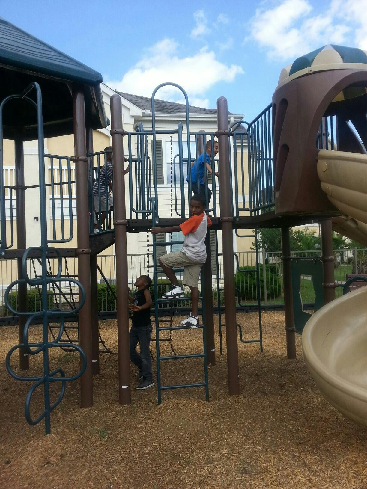 Children playing on a playground structure