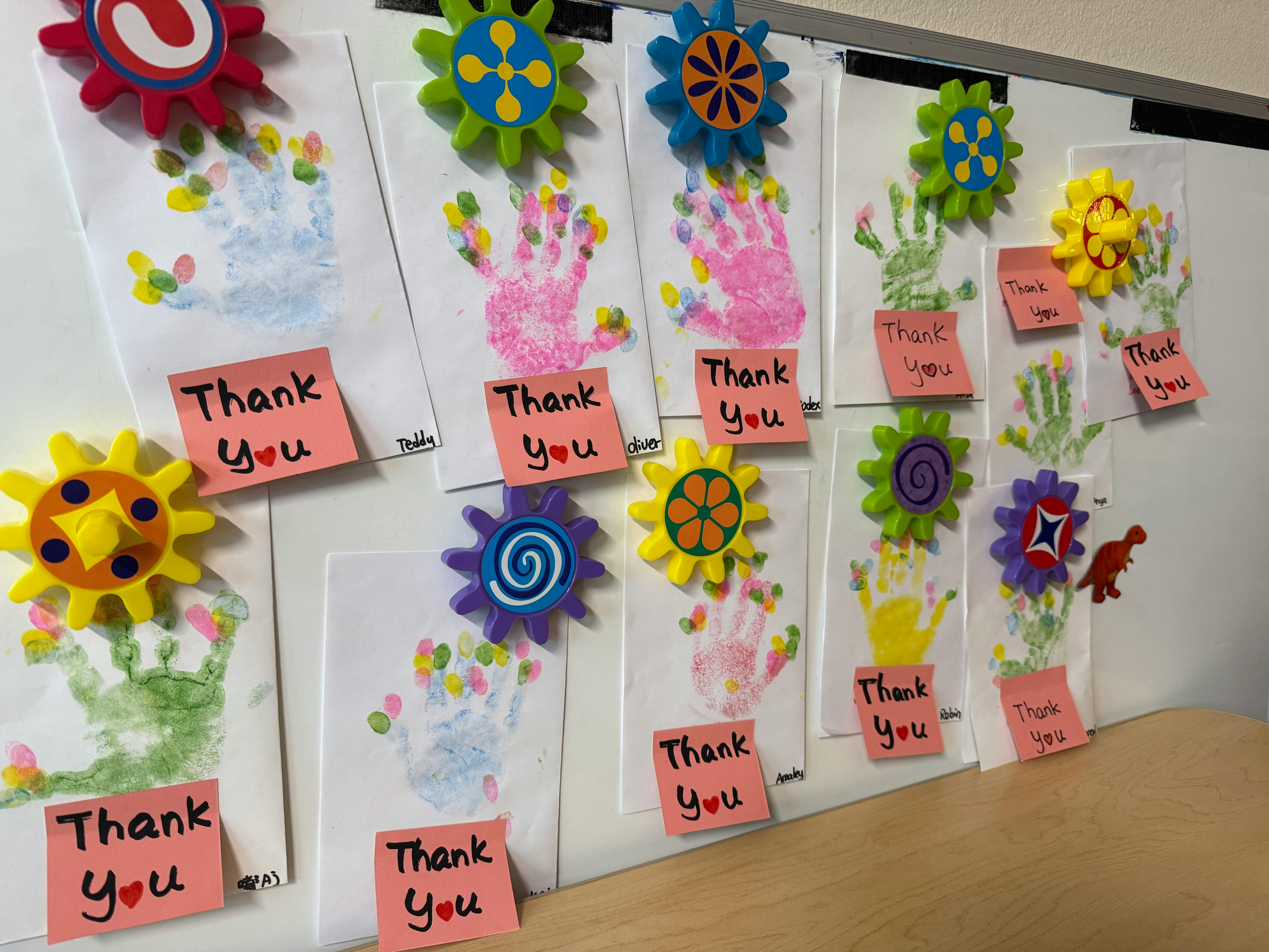 Children's handprint art with 'Thank You' notes