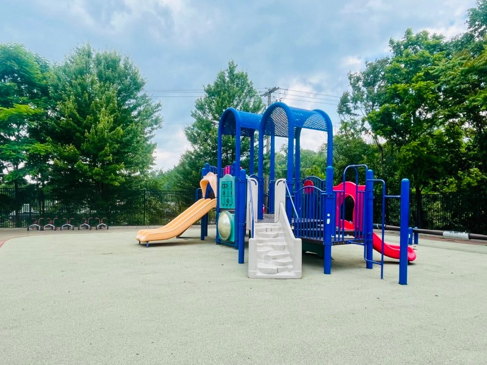 A colorful playground with slides and climbing structures