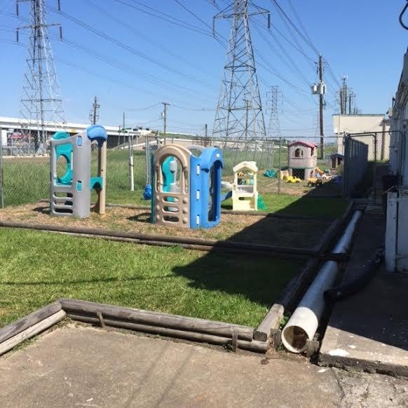 Playground with plastic play structures under power lines