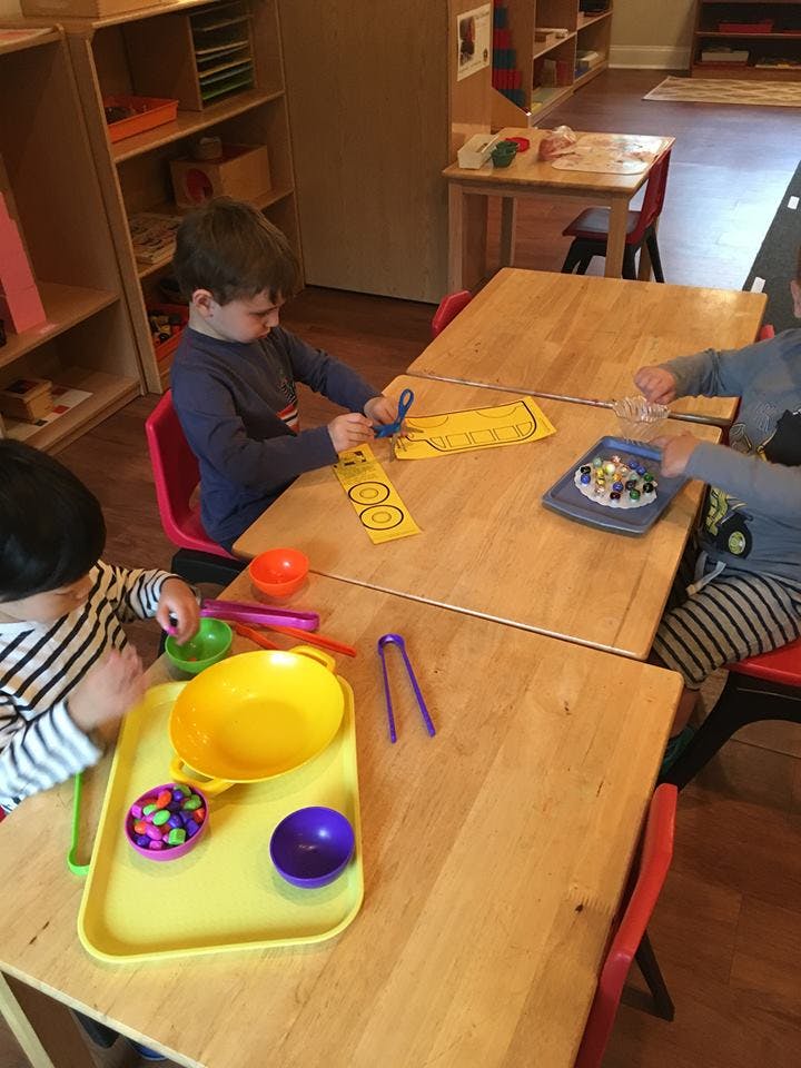 Children at a table with craft supplies