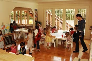 Adults and children in a classroom