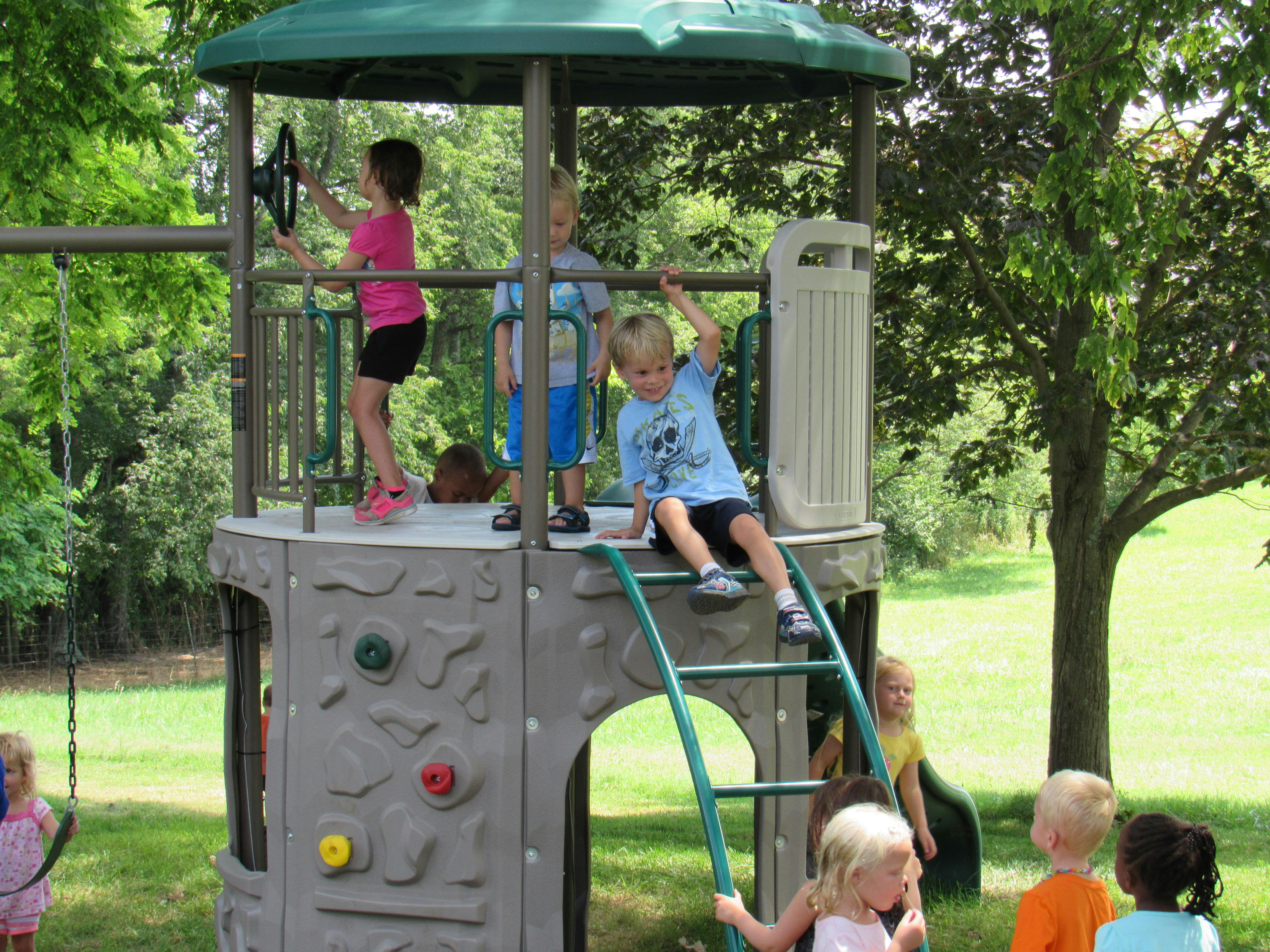 Children playing on a playground structure