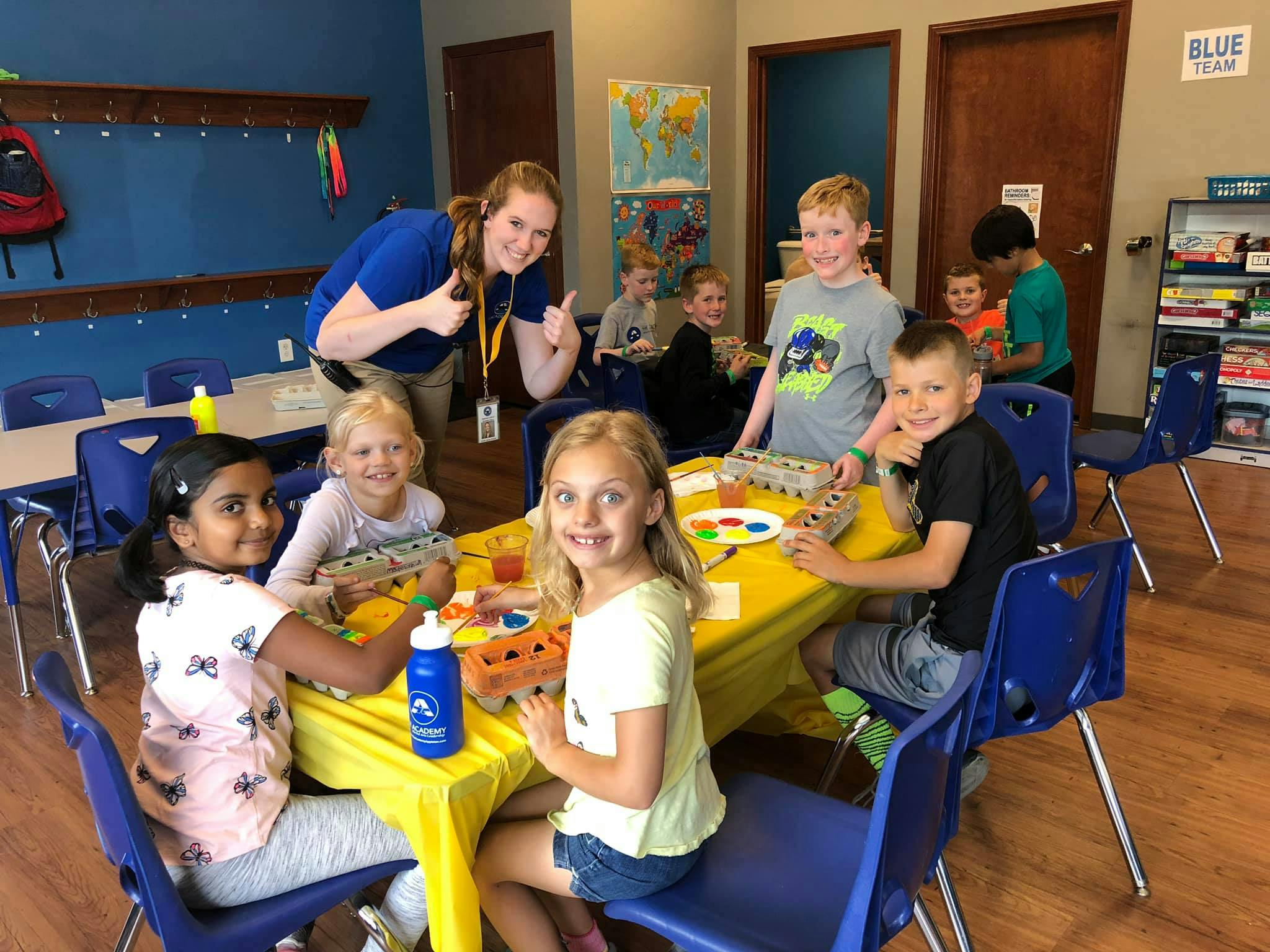 Adult and children in a classroom