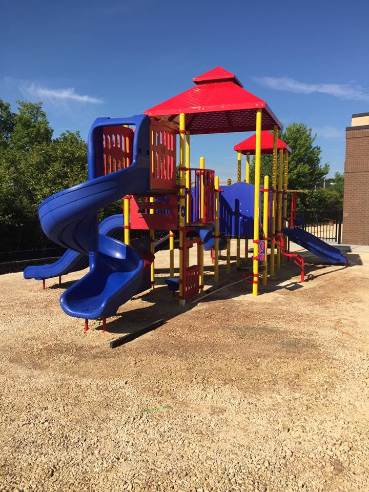 Playground structure with slides and climbing areas