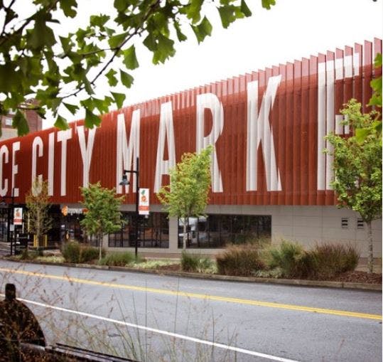 Building with "CITY MARKET" on its side, seen from across a street
