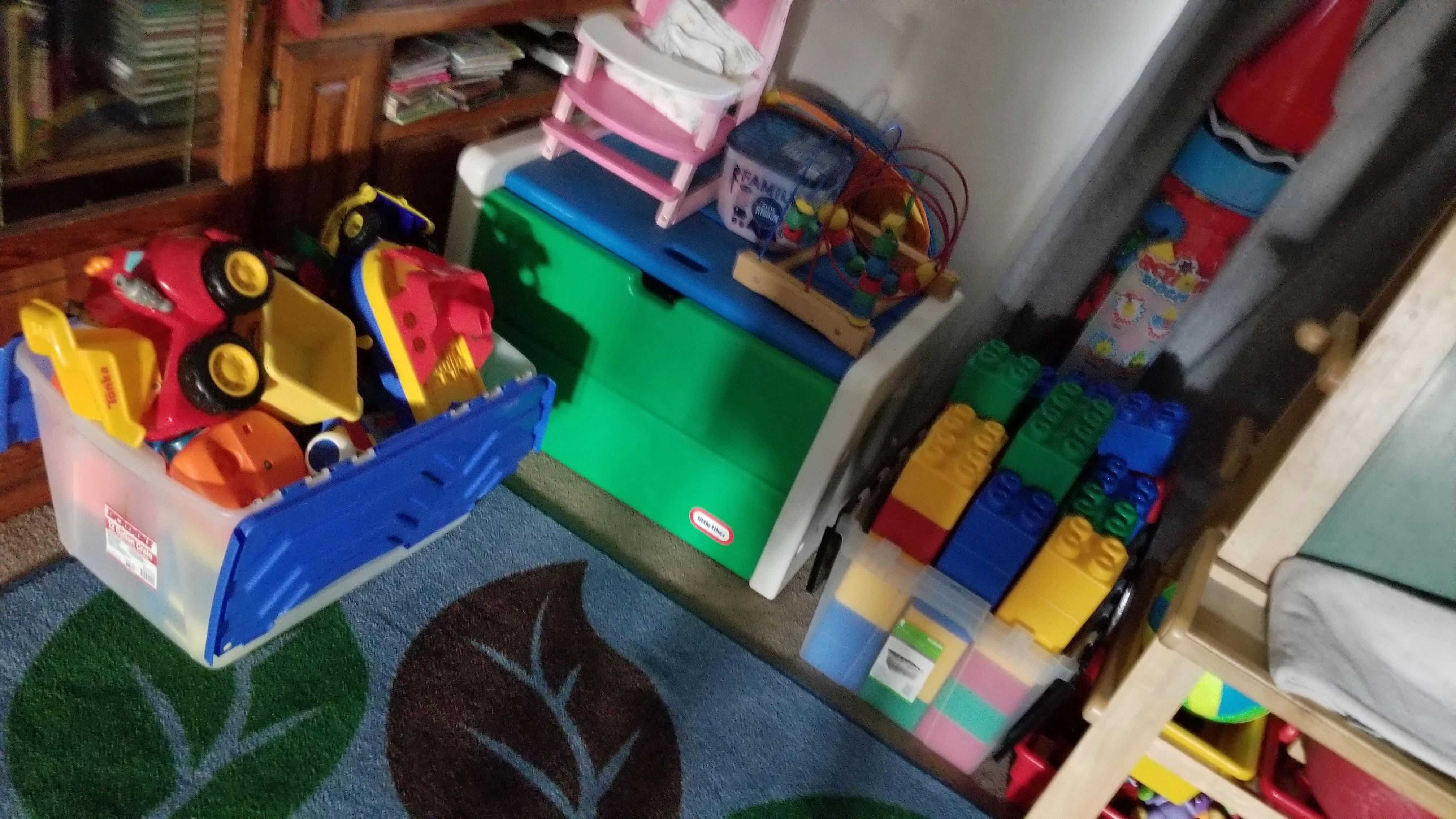 Toy trucks and other toys in storage bins