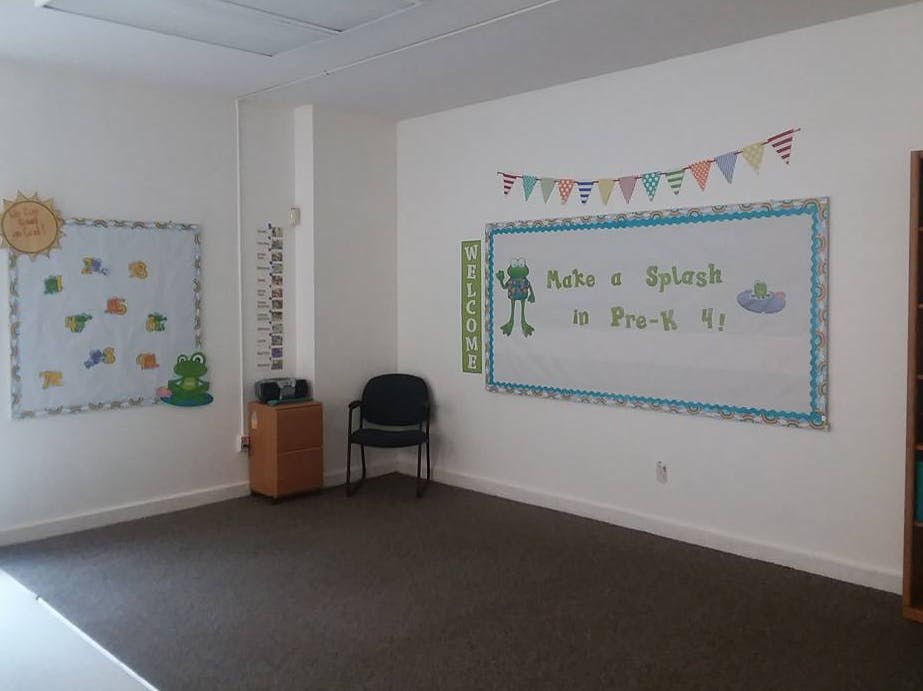 Classroom with bulletin boards and a chair